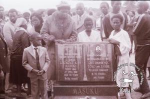 Mrs Masuku and her children at the gravesite during the memorial service for her husband, Lookout Masuku