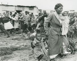 People fleeing a police raid on Crossroads in Cape Town